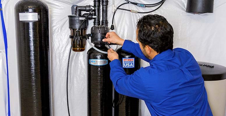 Man working a Kinetico Water Softener
